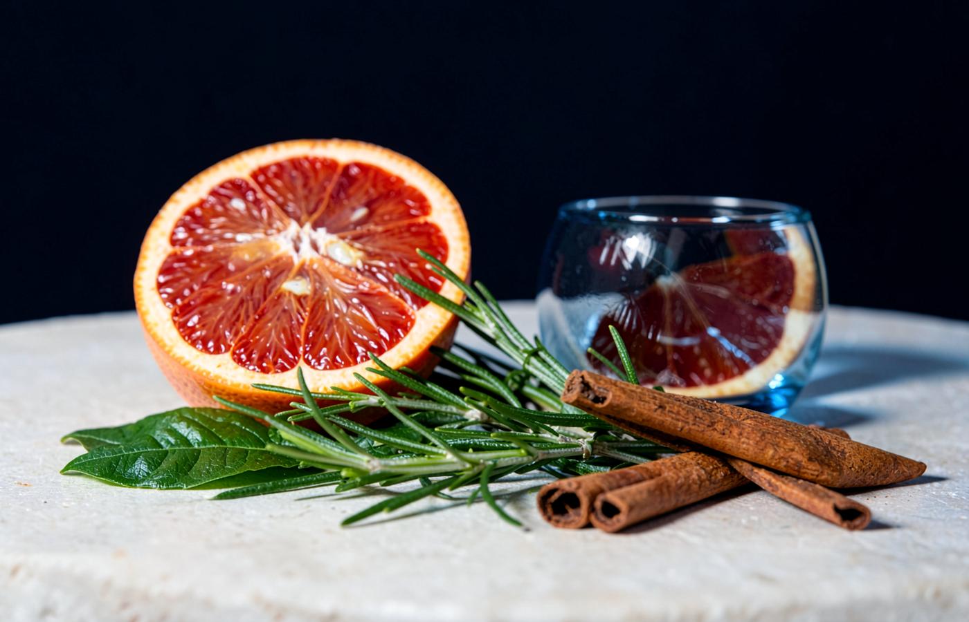 Citrus, rosemary and cinnamon arranged for a wellness still life